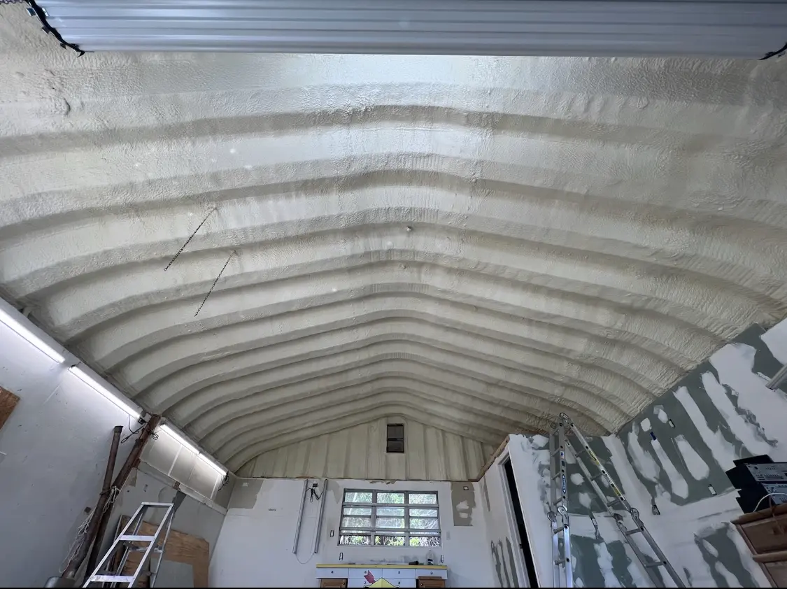 Spray polyurethane foam applied to the underside of a metal roof deck in St. Joseph